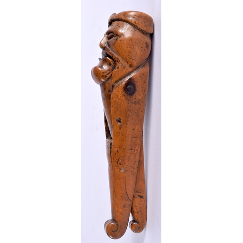 606 - A LOVELY PAIR OF 18TH CENTURY CARVED TREEN WOOD NUTCRACKERS, formed as a male with a large chin, bea... 