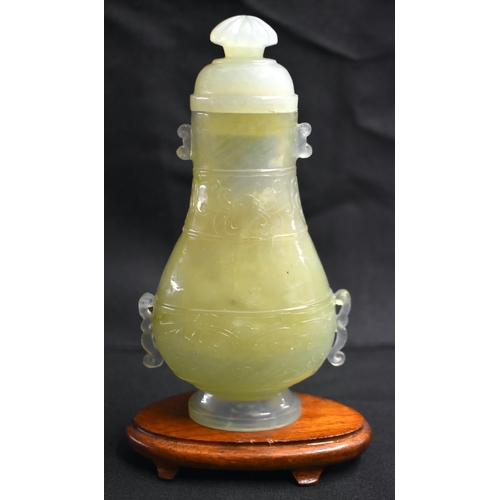 6 - A LATE 19TH CENTURY CHINESE TWIN HANDLED JADE VASE AND COVER Late Qing, with Mughal style finial and... 