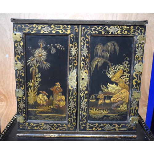 663 - AN EARLY 19TH CENTURY ENGLISH BLACK LACQUER TABLE CABINET ON STAND embellished with Chinoiserie scen... 