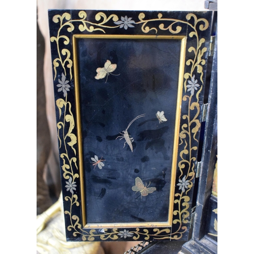 663 - AN EARLY 19TH CENTURY ENGLISH BLACK LACQUER TABLE CABINET ON STAND embellished with Chinoiserie scen... 