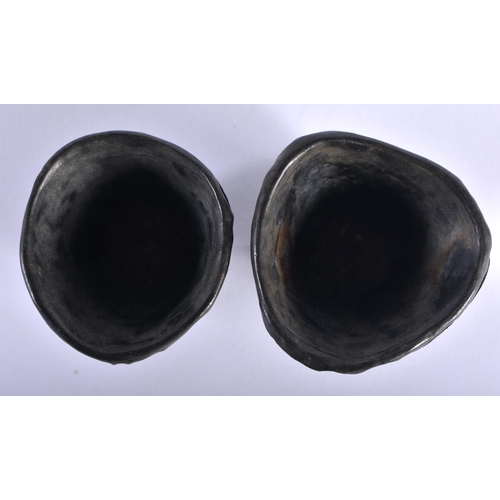 72 - A PAIR OF 17TH/18TH CENTURY CHINESE CARVED COCONUT SHELL CUPS Kangxi/Yongzheng, decorated with trees... 