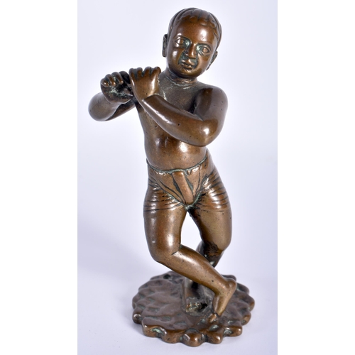 91 - A VERY UNUSUAL 18TH CENTURY INDIAN BRONZE FIGURE OF A EUROPEAN BOY modelled wearing shorts playing a... 