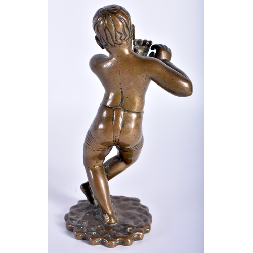 91 - A VERY UNUSUAL 18TH CENTURY INDIAN BRONZE FIGURE OF A EUROPEAN BOY modelled wearing shorts playing a... 