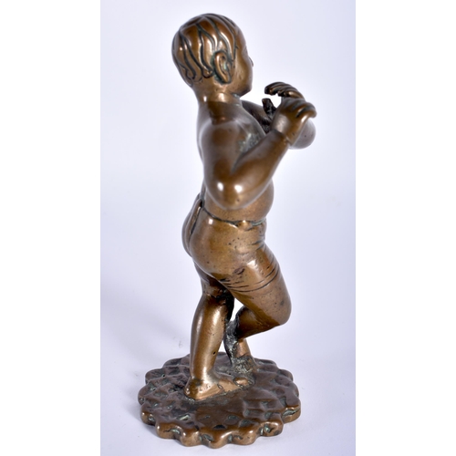 91 - A VERY UNUSUAL 18TH CENTURY INDIAN BRONZE FIGURE OF A EUROPEAN BOY modelled wearing shorts playing a... 