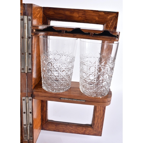 100C - A GENTLEMANS DRINKING COMPENDIUM, consisting of three decanters, four glasses, and three sherry glas... 