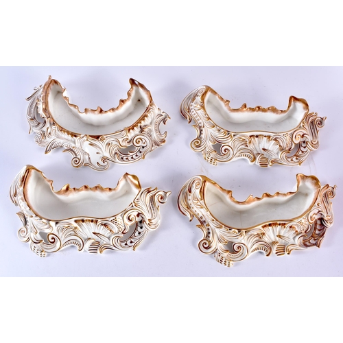 100B - A SET OF FOUR DOULTON BURSLEM PORCELAIN POSY HOLDERS. Largest 29cm wide