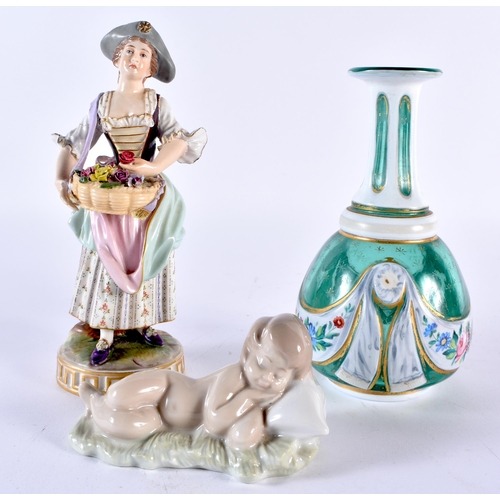 100E - A PORCELAIN VIENNA FIGURE OF A FEMALE FLOWER SELLER, together with a Lladro figure of a sleeping chi... 