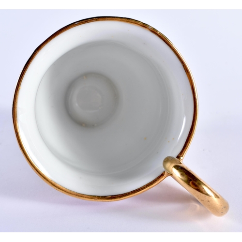 104 - AN EARLY 19TH CENTURY FRENCH PARIS EMPIRE PORCELAIN CUP AND SAUCER together with a later French Sevr... 