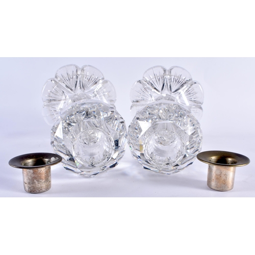 106 - AN UNUSUAL PAIR OF ANTIQUE CUT GLASS FACETTED CANDLESTICKS. 20 cm high.