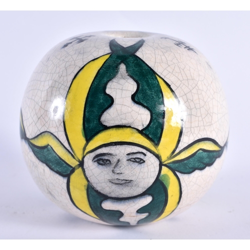 111 - AN ARMENIAN GREEN AND YELLOW HANGING BALL. 9 cm wide.