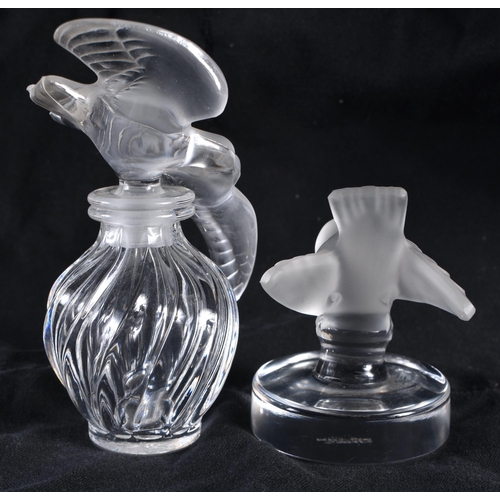 116 - A LALIQUE GLASS SCENT BOTTLE together with a Lalique glass bird. Largest 11 cm high. (2)