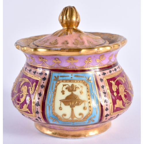 117 - AN ANTIQUE VIENNA PORCELAIN INKWELL AND COVER painted with putti. 14 cm wide.