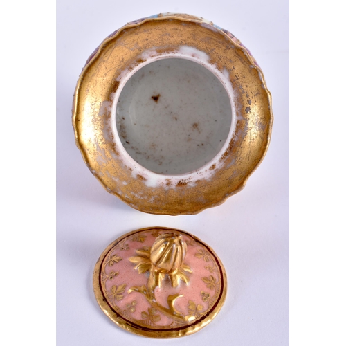 117 - AN ANTIQUE VIENNA PORCELAIN INKWELL AND COVER painted with putti. 14 cm wide.