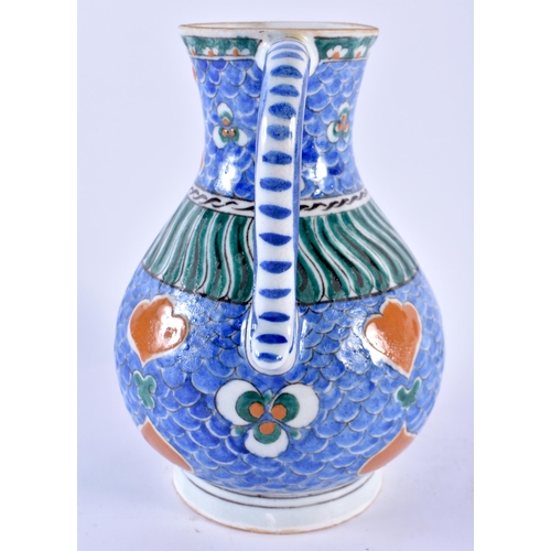 123 - A TURKISH OTTOMAN IZNIK POTTERY WATER JUG painted with motifs. 21 cm x 13 cm.