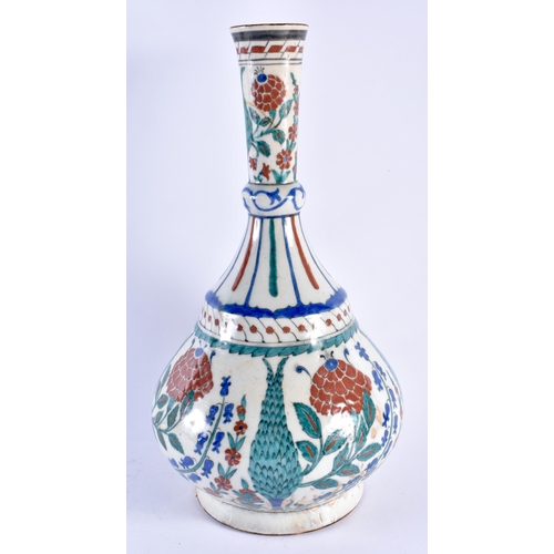 124 - A LARGE TURKISH OTTOMAN IZNIK POTTERY BULBOUS VASE painted with floral sprays. 40 cm x 17 cm.