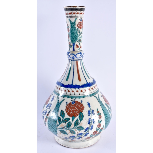 124 - A LARGE TURKISH OTTOMAN IZNIK POTTERY BULBOUS VASE painted with floral sprays. 40 cm x 17 cm.