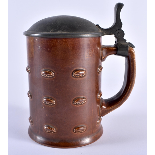 126 - AN ANTIQUE GERMAN MERKELBACH GRENZHAUSEN STONEWARD TANKARD in the Arts and Crafts manner. 16 cm x 12... 