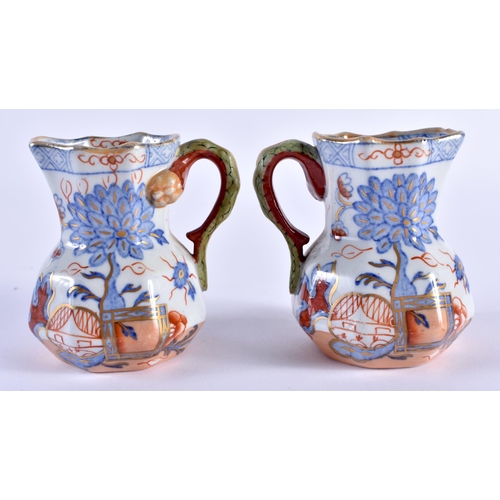 129 - A RARE PAIR OF MASONS MINIATURE IRONSTONE HYDRA TYPE JUGS. 7 cm x 6 cm.