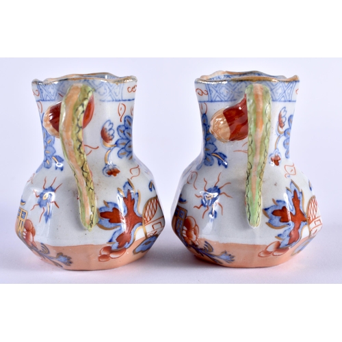 129 - A RARE PAIR OF MASONS MINIATURE IRONSTONE HYDRA TYPE JUGS. 7 cm x 6 cm.