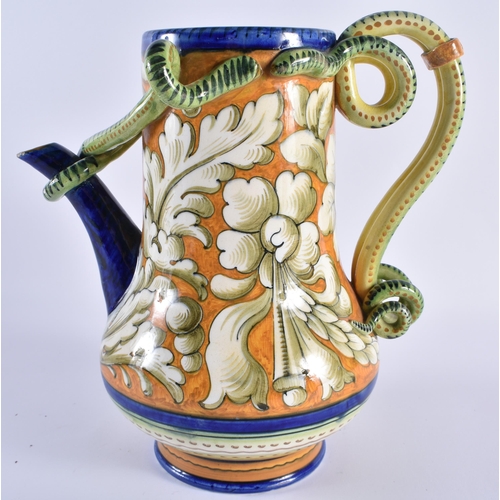 131 - AN ITALIAN MAJOLICA FAIENCE SERPENT JUG painted with floral sprays. 24 cm x 17 cm.