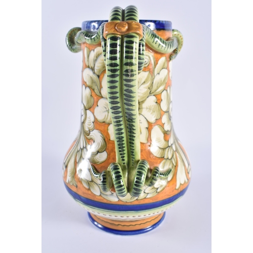 131 - AN ITALIAN MAJOLICA FAIENCE SERPENT JUG painted with floral sprays. 24 cm x 17 cm.