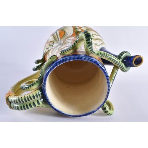 131 - AN ITALIAN MAJOLICA FAIENCE SERPENT JUG painted with floral sprays. 24 cm x 17 cm.