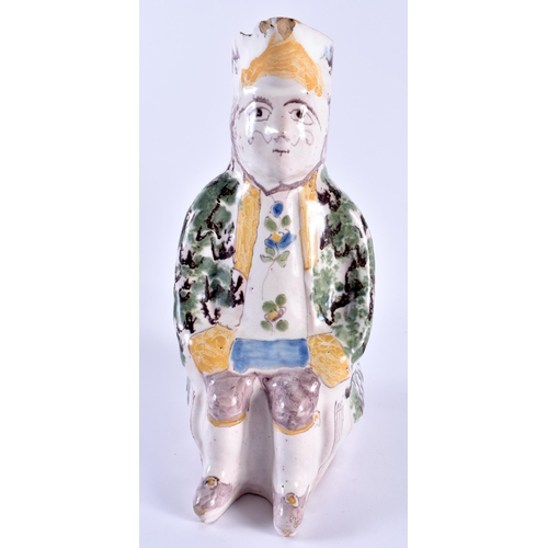 147 - AN 18TH/19TH CENTURY FRENCH FAIENCE TIN GLAZED JUG modelled as a seated male. 24 cm x 10 cm.