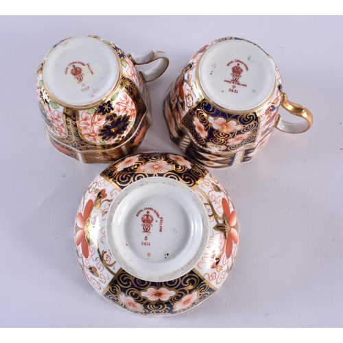 195 - Royal Crown Derby pattern 1128 two coffee cups, saucers, side plates, a coffee cup, saucer and side ... 