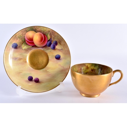 217 - Royal Worcester teacup and saucer, the cup painted inside with fruit by Harry Ayrton, signed the sau... 