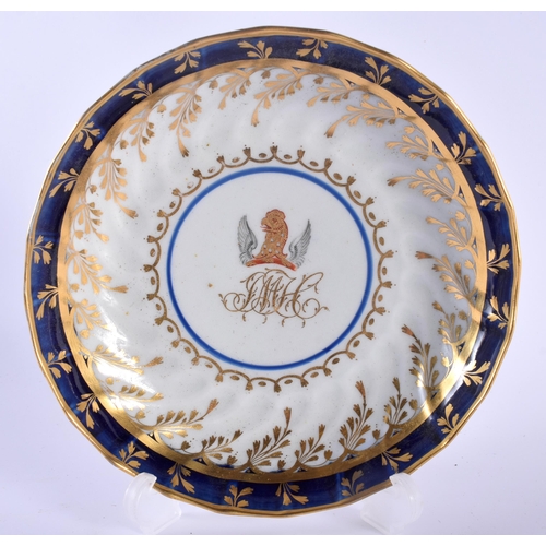 22 - AN OVERSIZED 18TH CENTURY WORCESTER FLUTED ARMORIAL TEABOWL AND SAUCER painted with a central crest ... 