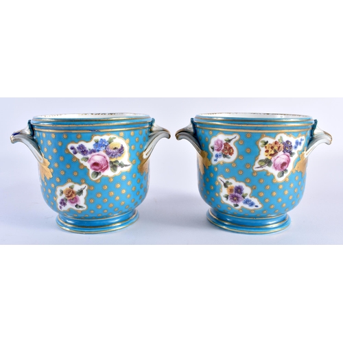 233 - Sevres pair of bottle coolers painted with asymmetric gilt panel of flowers on a turquoise ground, c... 