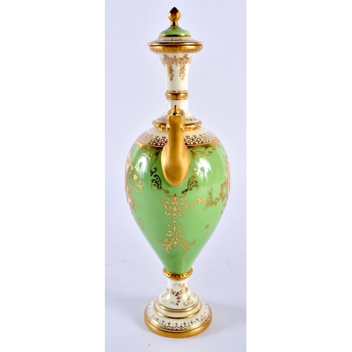 253 - Late 19th early 20th century Coalport apple green vase and cover. 23cm high