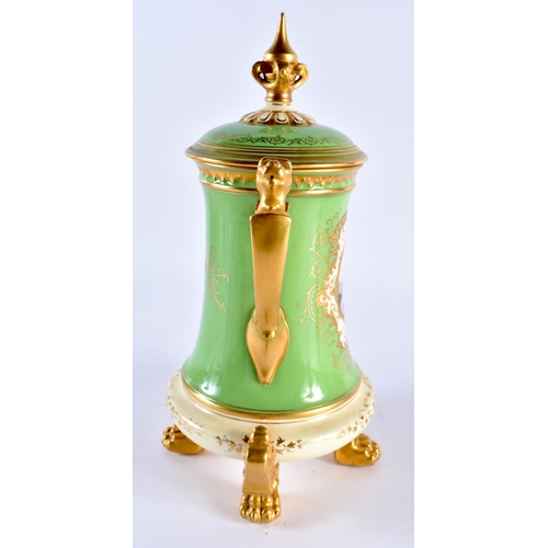 254 - Late 19th early 20th century Coalport green ground vase and cover with lion handles. 25cm high