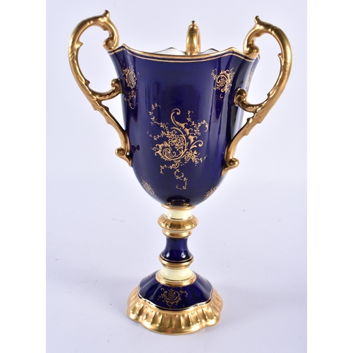 255 - Late 19th early 20th century Coalport three handled loving cup painted with a Loch scene on a cobalt... 