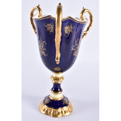 255 - Late 19th early 20th century Coalport three handled loving cup painted with a Loch scene on a cobalt... 