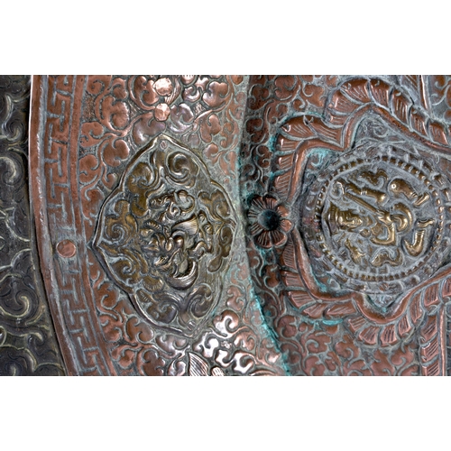 304 - A VERY LARGE 19TH CENTURY INDIAN TIBETAN COPPER AND MIXED METAL CHARGER of monumental proportions, i... 