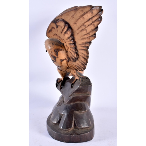 306 - AN ANTIQUE BAVARIAN BLACK FOREST CARVED WOOD HAWK. 21 cm x 13 cm.