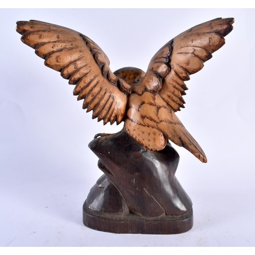 306 - AN ANTIQUE BAVARIAN BLACK FOREST CARVED WOOD HAWK. 21 cm x 13 cm.