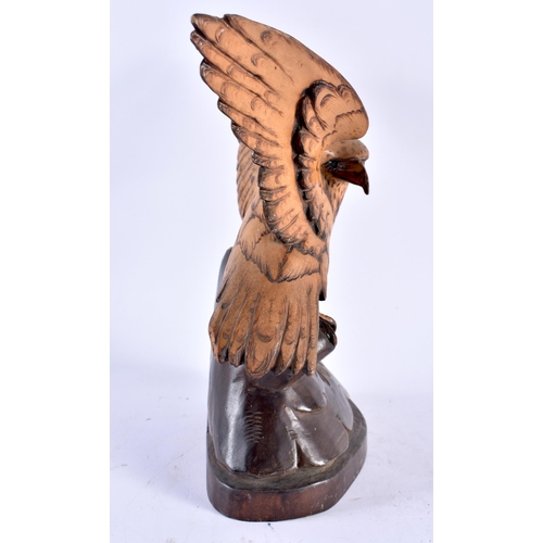 306 - AN ANTIQUE BAVARIAN BLACK FOREST CARVED WOOD HAWK. 21 cm x 13 cm.