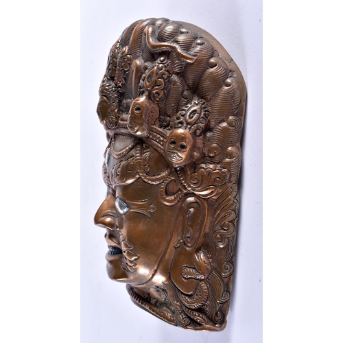 312 - AN 18TH/19TH CENTURY SINO TIBETAN SILVER INLAID BRONZE MASK formed as a scowling male deity. 14 cm x... 