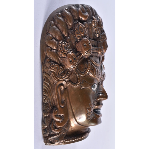 312 - AN 18TH/19TH CENTURY SINO TIBETAN SILVER INLAID BRONZE MASK formed as a scowling male deity. 14 cm x... 