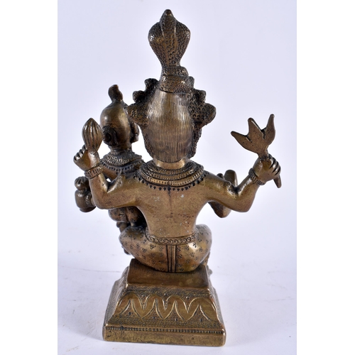 319 - A 19TH CENTURY INDIAN BRONZE FIGURE OF A HINDU DEITY modelled with an attendant. 17 cm x 10 cm.