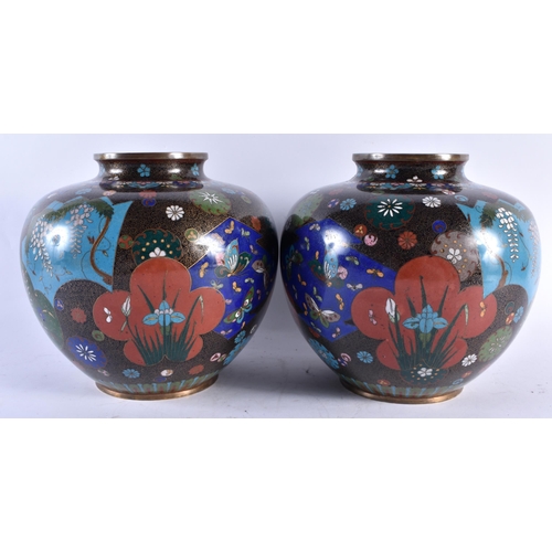 320 - A LARGE PAIR OF 19TH CENTURY JAPANESE MEIJI PERIOD CLOISONNE ENAMEL VASES decorative with panels of ... 