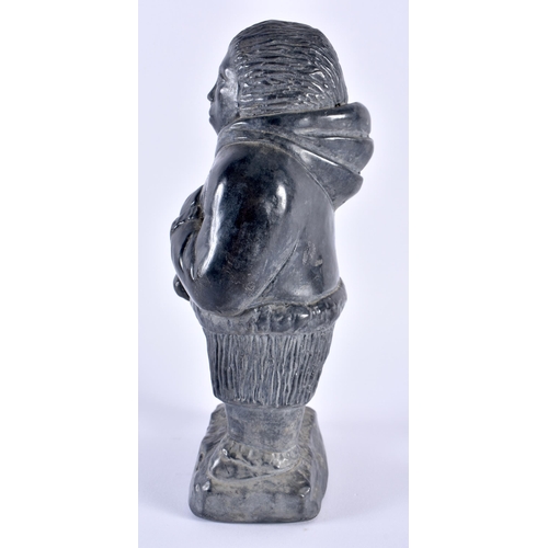 329 - AN INUIT NORTH AMERICAN FIGURE OF AN ESKIMO. 21 cm high.