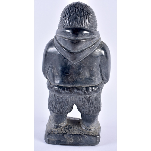 329 - AN INUIT NORTH AMERICAN FIGURE OF AN ESKIMO. 21 cm high.