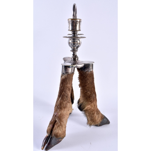 340 - A RARE VICTORIAN TAXIDERMY ROWLAND WARD CANDLESTICK formed with three deer hooves. 32 cm x 16 cm.