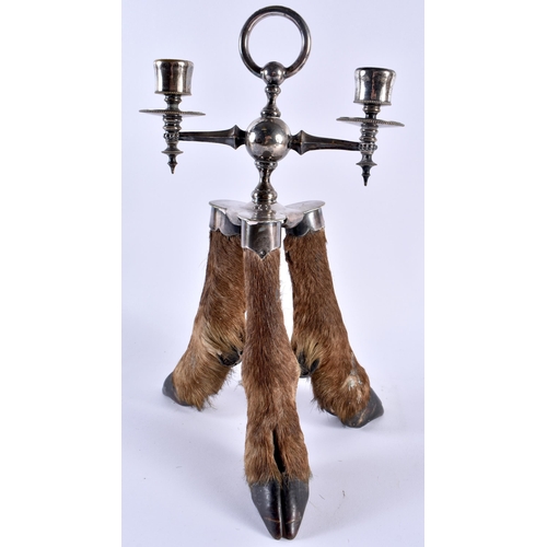 340 - A RARE VICTORIAN TAXIDERMY ROWLAND WARD CANDLESTICK formed with three deer hooves. 32 cm x 16 cm.