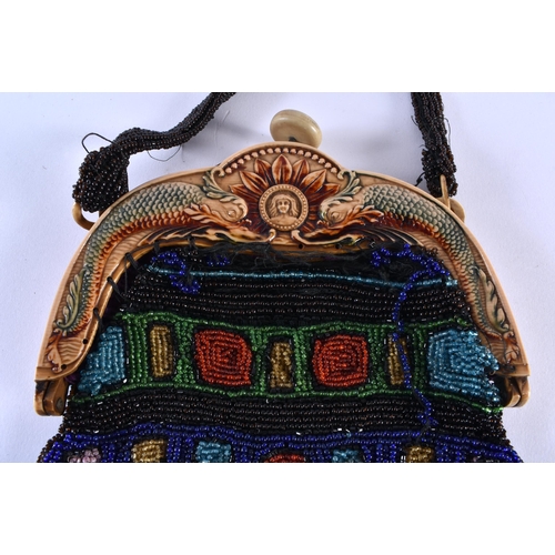 352 - AN ART DECO BEADWORK PURSE the mounts decorated with a mythical dolphins. 38 cm x 15 cm.