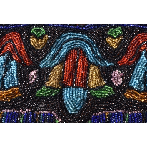 352 - AN ART DECO BEADWORK PURSE the mounts decorated with a mythical dolphins. 38 cm x 15 cm.