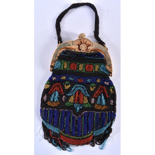 352 - AN ART DECO BEADWORK PURSE the mounts decorated with a mythical dolphins. 38 cm x 15 cm.